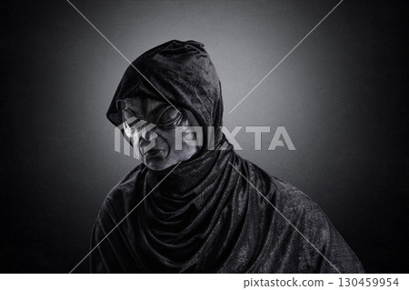 Mysterious humanoid alien at night over dark misty background 130459954