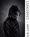 Mysterious humanoid alien at night over dark misty background 130459955