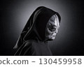 Mysterious humanoid alien at night over dark misty background 130459958