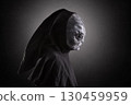 Mysterious humanoid alien at night over dark misty background 130459959