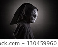 Mysterious humanoid alien at night over dark misty background 130459960