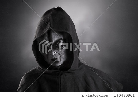 Mysterious humanoid alien at night over dark misty background 130459961