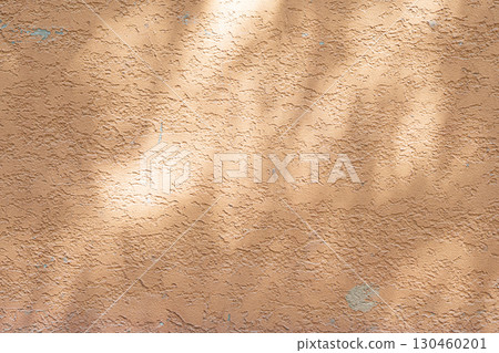 Wall with texture and shadows. Orange, brown concrete background Wall with texture and shadows. Orange, brown concrete background 130460201