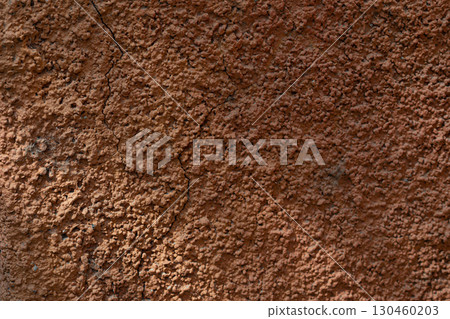Wall with texture and shadows. Orange, brown concrete background 130460203
