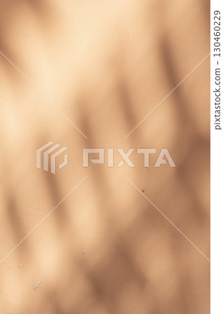 Wall with texture and shadows. Orange, brown concrete background 130460229