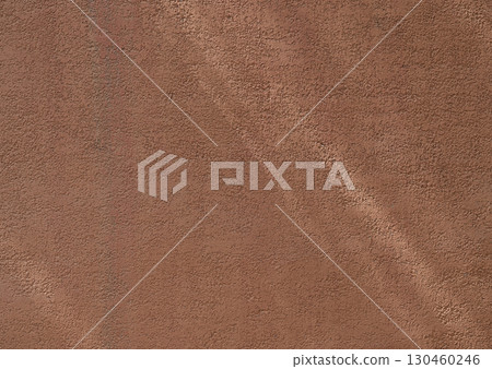 Wall with texture and shadows. Orange, brown concrete background 130460246