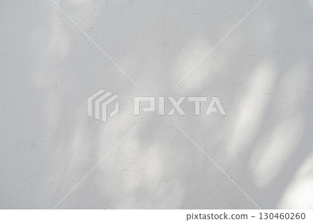 Wall with texture and shadows. Grey concrete background 130460260