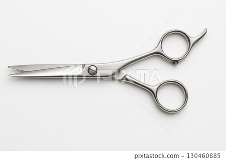 Professional hair cutting scissors with precise blades, designed for beauty salons, showcasing clean and sleek composition 130460885