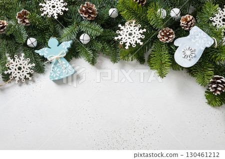 Christmas frame with evergreen branches and carving wooden angel. Xmas card. 130461212