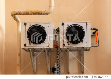air conditioners are mounted on the wall. technologies for air cooling in hot weather. 130462156