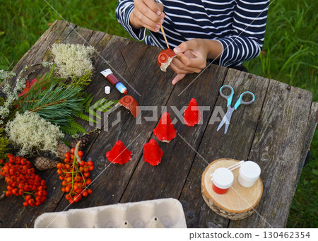 Eco-conscious craft activities for kindergarteners involving paper and natural objects. 130462354