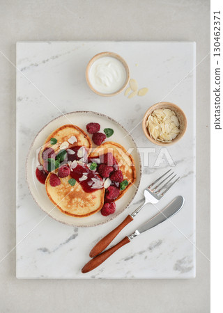 Homemade pancakes with yoghurt and fresh raspberry 130462371