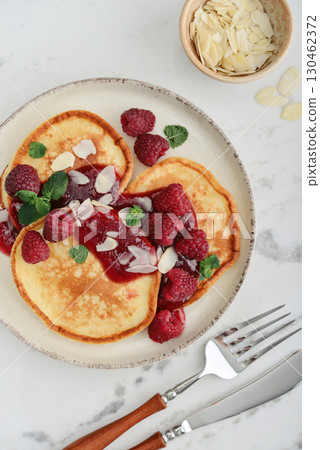 Homemade pancakes with yoghurt and fresh raspberry 130462372