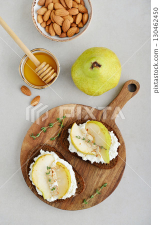 Bruschetta with cream cheese, honey, pear, thyme Bruschetta with cream cheese, honey, pear, thyme 130462450
