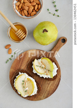 Bruschetta with cream cheese, honey, pear, thyme Bruschetta with cream cheese, honey, pear, thyme 130462451