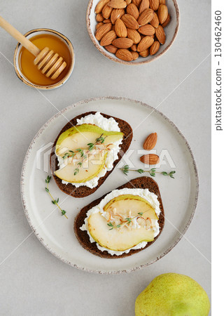 Bruschetta with cream cheese, honey, pear, thyme Bruschetta with cream cheese, honey, pear, thyme 130462460