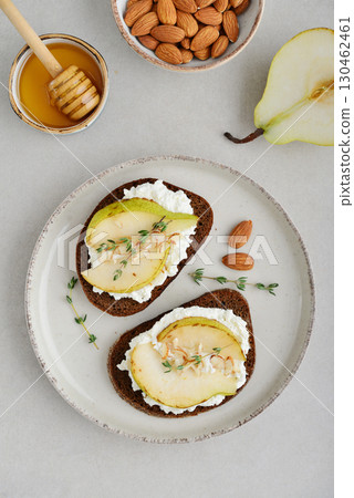 Bruschetta with cream cheese, honey, pear, thyme Bruschetta with cream cheese, honey, pear, thyme 130462461