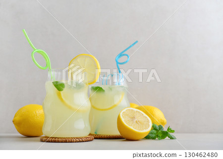 Two glasses of homemade lemonade with drinking straws Two glasses of homemade lemonade with drinking straws 130462480