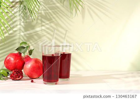 Pomegranate juice drink and ingredients, rich pomegranate drink on elegant sunny table, detox diet and weight loss concept, natural food for healthy lifestyle, source of vitamin C 130463167
