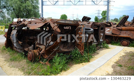 Rusty and burned-out armored vehicles on ukrainian territory. Exhibition of destroyed military equipment of the russian army. War between Ukraine and russia. Close up Slow motion 130463229