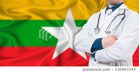 Myanmar healthcare concept. Male doctor on Myanmar flag. Doctor with crossed arms on Myanmar flag 130463543