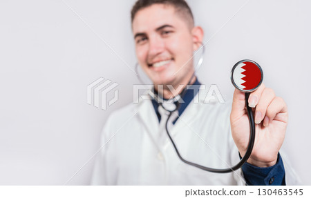 Doctor showing stethoscope with Bahrain flag. Bahrain national healthcare concept 130463545
