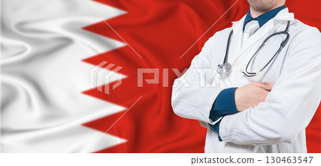 Bahrain healthcare concept. Male doctor on Bahrain flag. Doctor with crossed arms on Bahrain flag 130463547