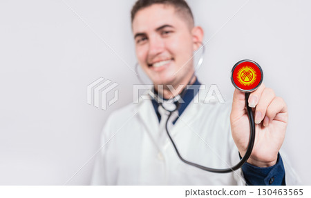 Doctor showing stethoscope with Kyrgyzstan flag. Kyrgyzstan national healthcare concept 130463565