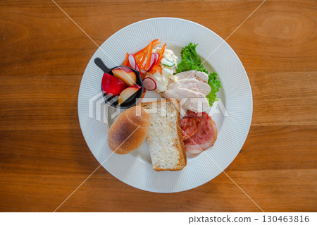 Western-style breakfast plate with bread and salad 130463816