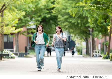 University campus female college student running University campus female college student running 130463988