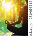 Yoga pose on forest platform at sunrise, peaceful and serene 130464412