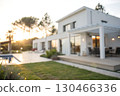Modern Minimalist House with Outdoor Space and Pool at Sunset in a Serene Environment Modern Minimalist House with Outdoor Space and Pool at Sunset in a Serene Environment 130466336