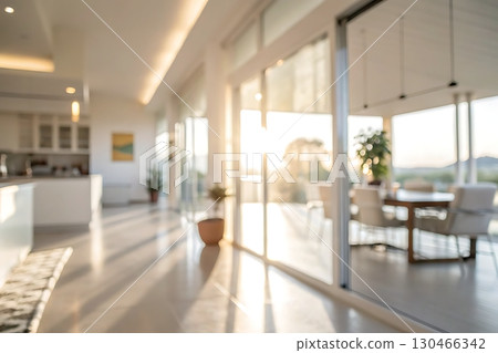 Modern Sunlit Interior with Glass Doors and Scenic View of Nature in a Luxurious Space 130466342