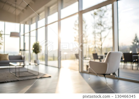 Bright and Airy Modern Living Room with Large Windows and Scenic View in Soft Focus 130466345