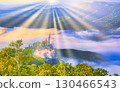 Morning image of a church towering over a sea of clouds 130466543