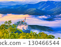 Morning image of a church towering over a sea of clouds 130466544