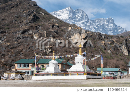 Tibetan Buddhist stupa in Khumjung village, Nepal. Khumjung is one of the most beautiful villages located in the remote area of the Everest region. 130466814