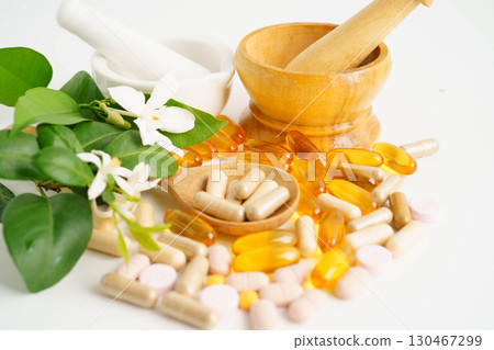 Alternative medicine herbal organic capsule with vitamin E omega 3 fish oil, mineral, drug with herbs leaf natural supplements for healthy good life. Alternative medicine herbal organic capsule with vitamin E omega 3 fish oil, mineral, drug with herbs leaf natural supplements for healthy good life. 130467299
