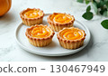 Mini pumpkin pie tarts snack dessert homemade in white plate copy space background 130467949