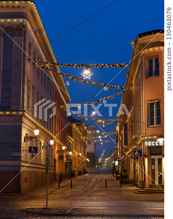Illuminated cobblestone streets of Helsinki at night 130468076