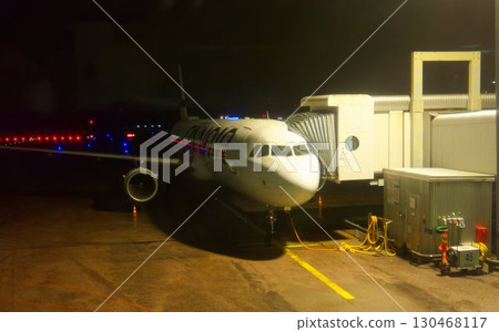 Passenger plane parked at night airport 130468117