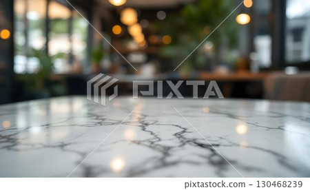 Empty marble table in a restaurant, featuring a blurred bokeh background, ideal for a product display mockup 130468239
