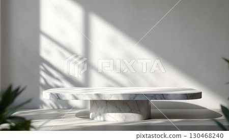 A white marble table with a plant, captured in a blurred bokeh effect, ideal for showcasing an empty product display mockup A white marble table with a plant, captured in a blurred bokeh effect, ideal for showcasing an empty product display mockup 130468240