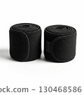 Pair of black elastic compression wraps rolled up 130468586
