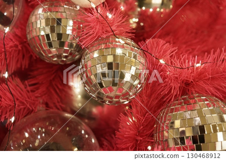 Glamorous Disco Ball Ornaments Adorn a Festive Christmas Tree Glamorous Disco Ball Ornaments Adorn a Festive Christmas Tree 130468912