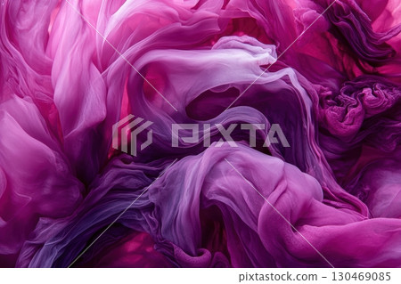 Swirling purple fabric creating a mesmerizing abstract pattern in soft hues 130469085