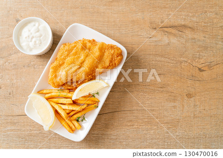 fish and chips - fried fish fillet with potatoes chips fish and chips - fried fish fillet with potatoes chips 130470016