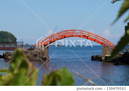 A red bridge that connects the islands and offers a panoramic view of the sea A red bridge that connects the islands and offers a panoramic view of the sea 130470581