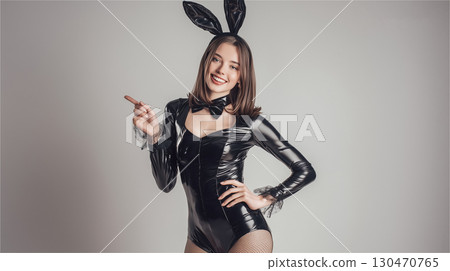 Portrait of a woman in a black bunny girl costume 130470765