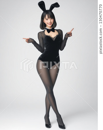 Portrait of a woman in a black bunny girl costume 130470770